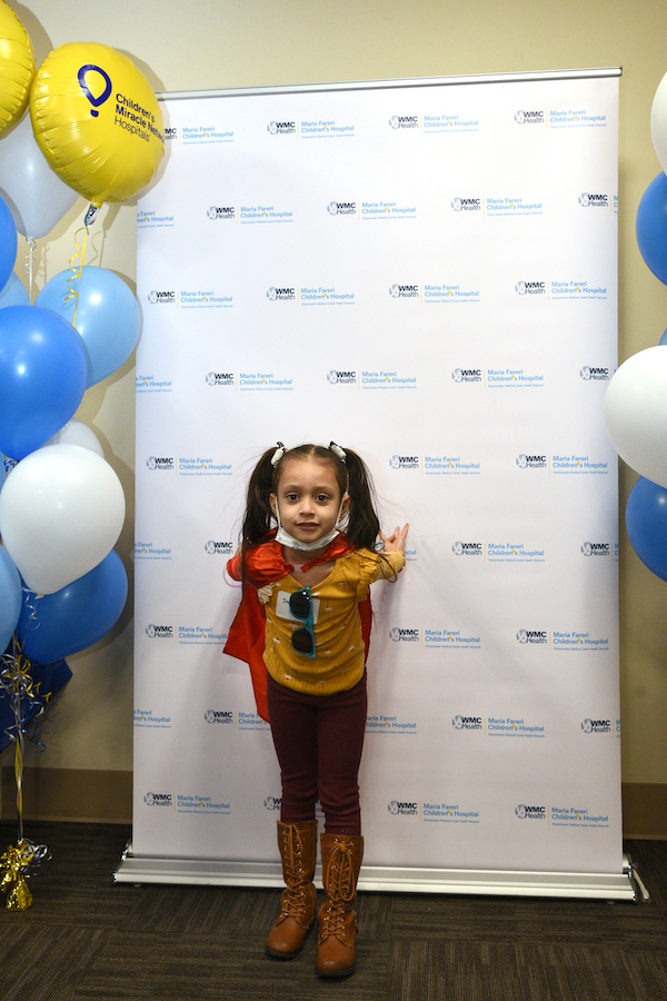 Little Girl Wearing a Cape at March 2023's "Succeeding At School with Hearing Loss and Cochlear Implants" Event